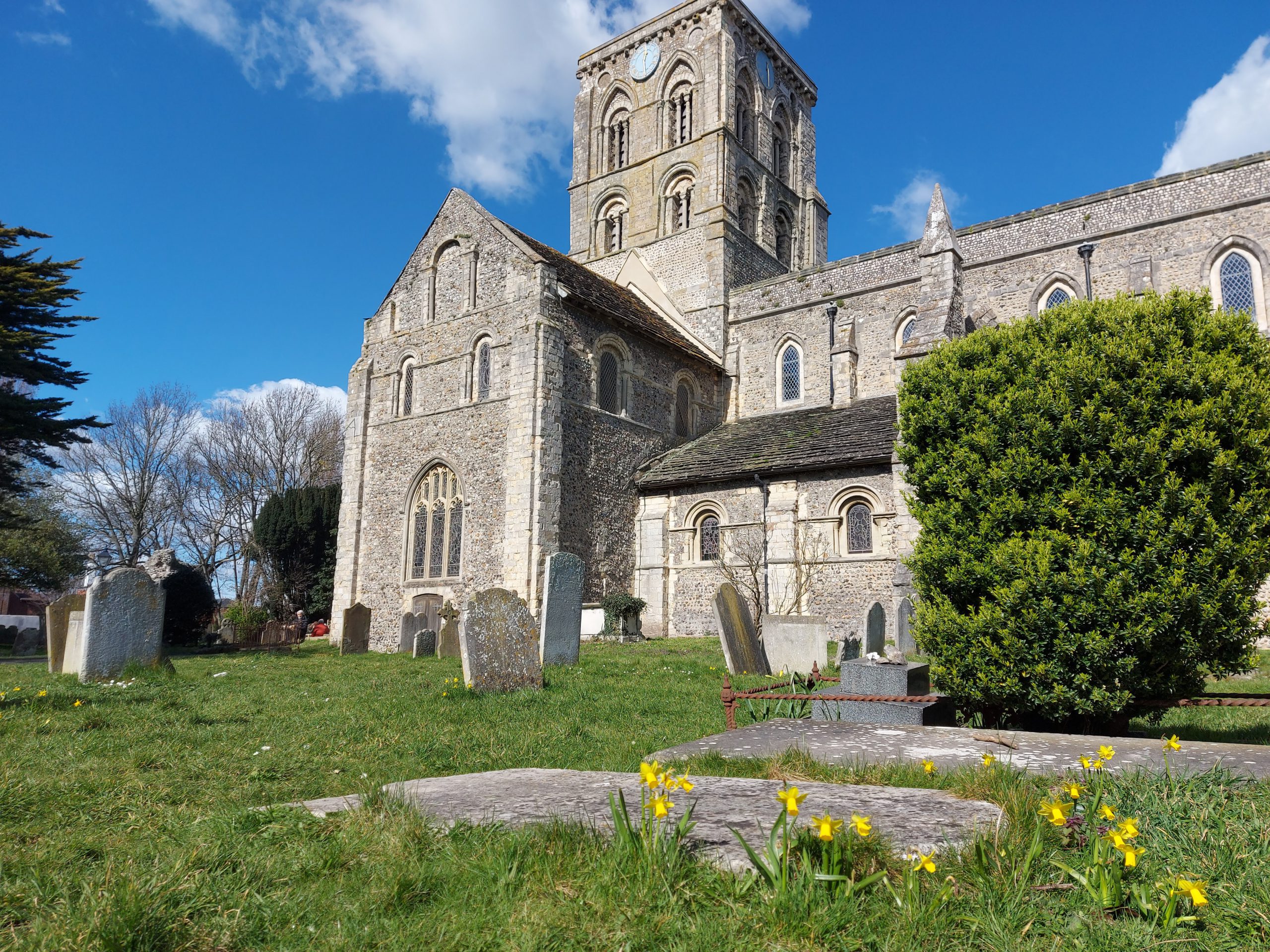 Shoreham Church, South Vista, blue sky, green grass.